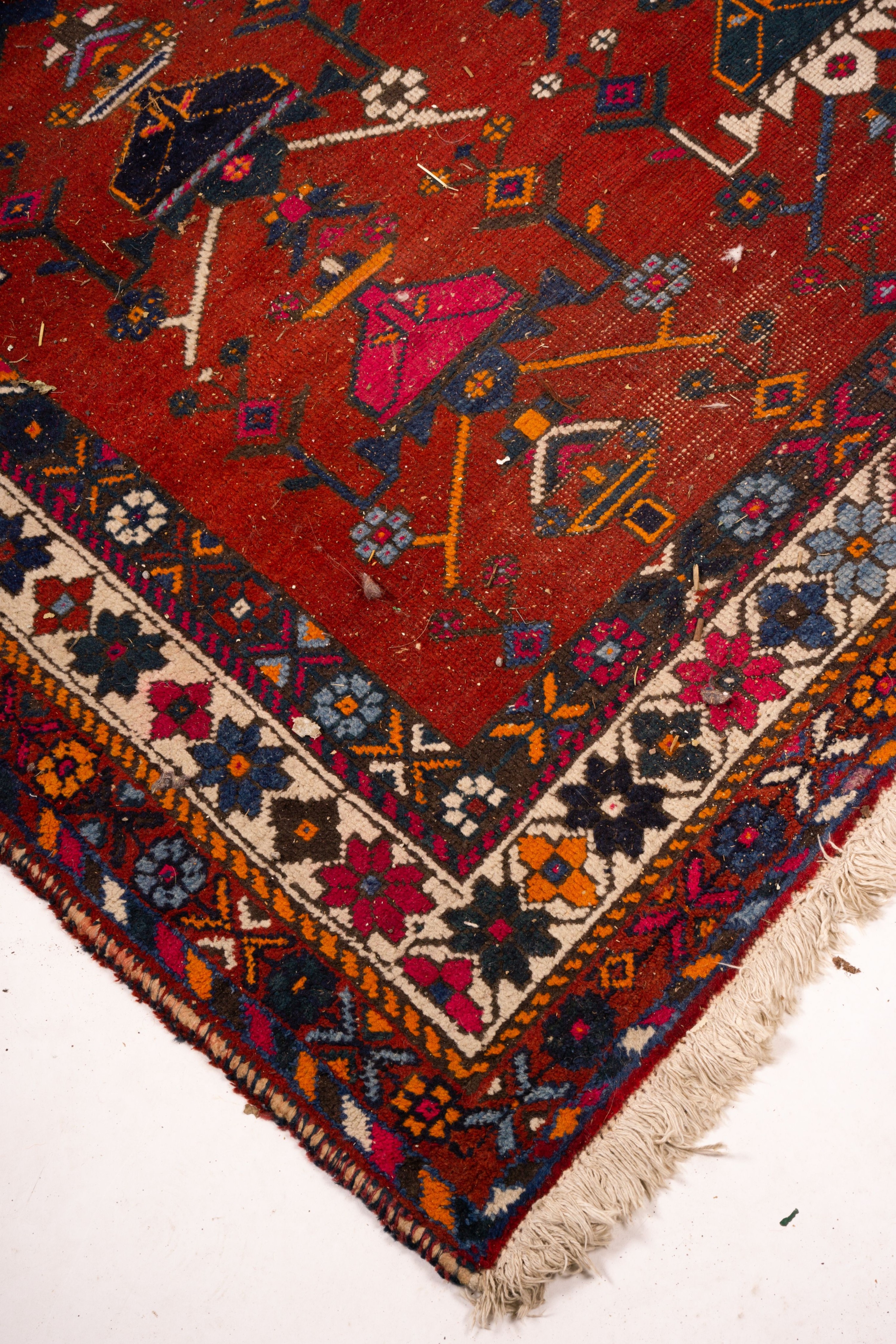 A Turkish red ground rug, 190 x 152cm